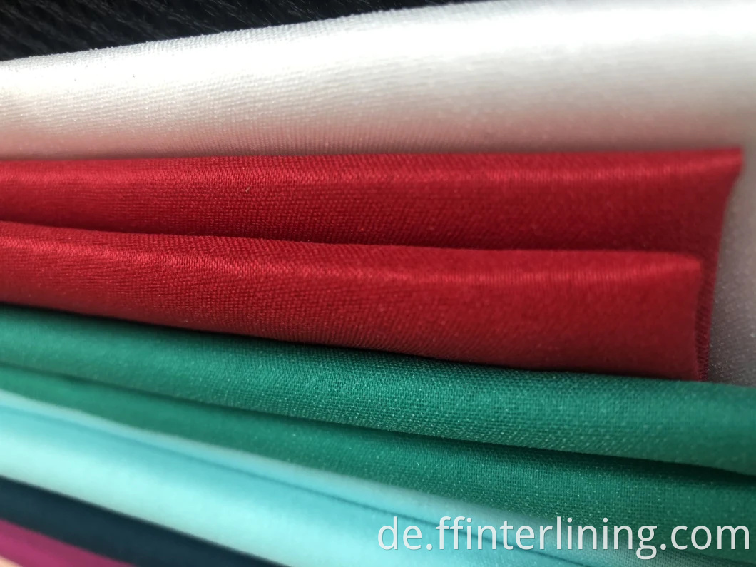 Großhandel Hohe Qualität 100% Polyester Woven Interlining Lieferant Hohe Qualität Elastizität Woven Fusible Fabric Farbe Interlining